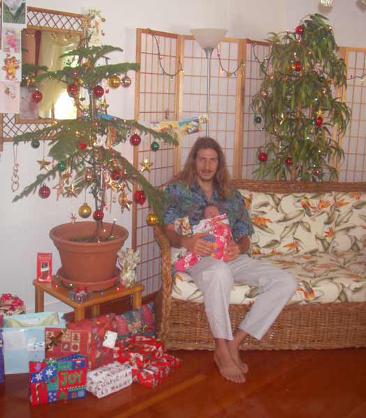 Andy and Leilani in front of the Christmas tree