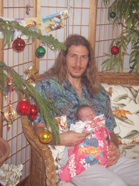 Andy and Leilani in front of the Christmas tree