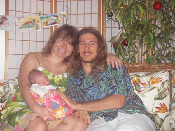 Andy, Sonja and Leilani in front of the Christmas tree