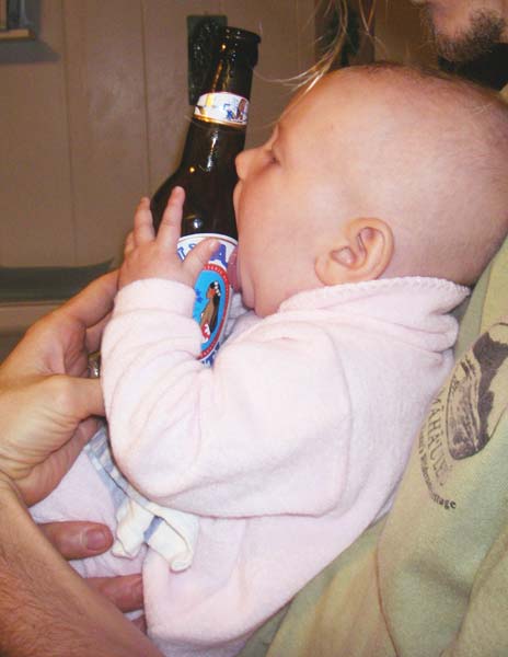 licking beer bottle