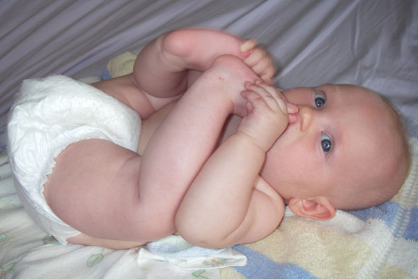  playing with toes diaper