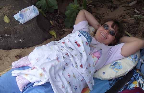 Leilani (covered) at the picnic at the Wailua Beach