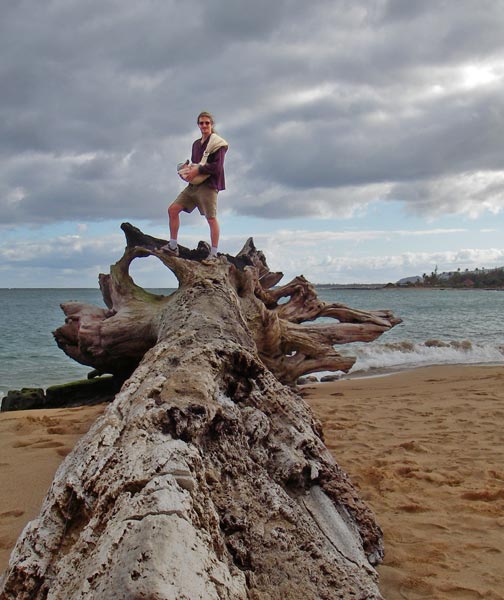 Andy on a log on Wailua Beach